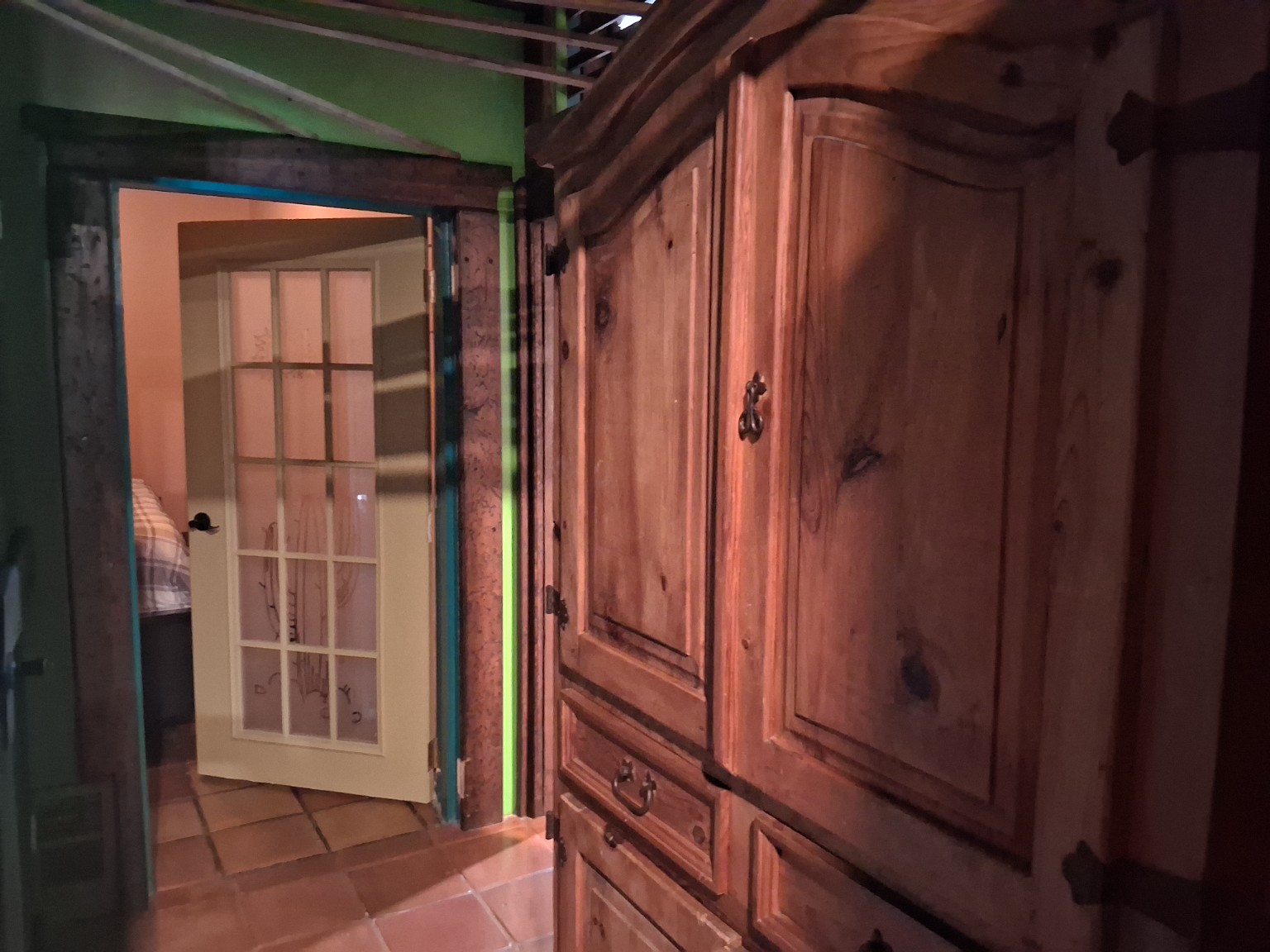 Rustic wood cabinetry and interior doorway