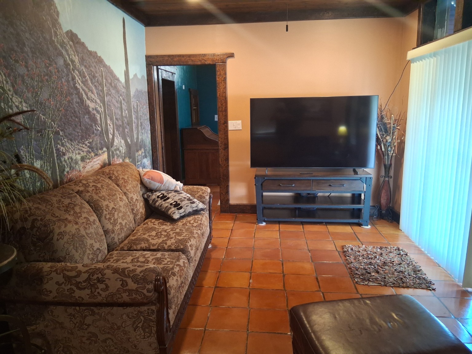 Living room with large television and sofa